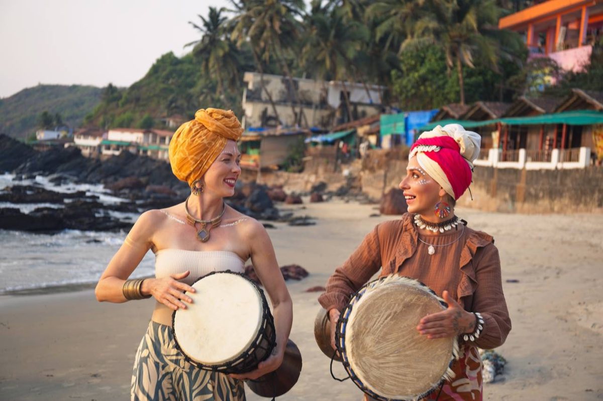 Svetlana and Veronika with djembes on the beach, Goa